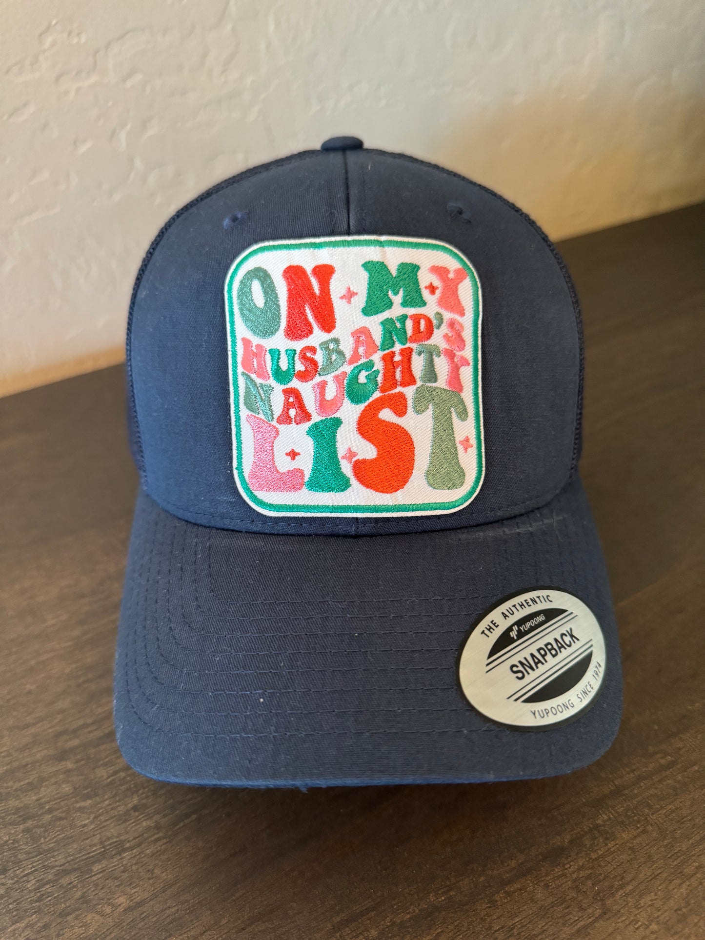 On My Husband's Naughty List Trucker Hat